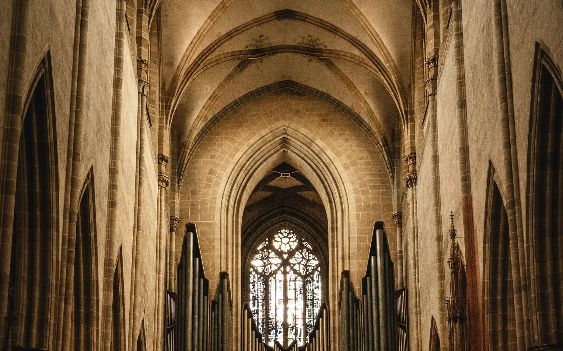 A cathedral nave with visitors on Purple WiFi